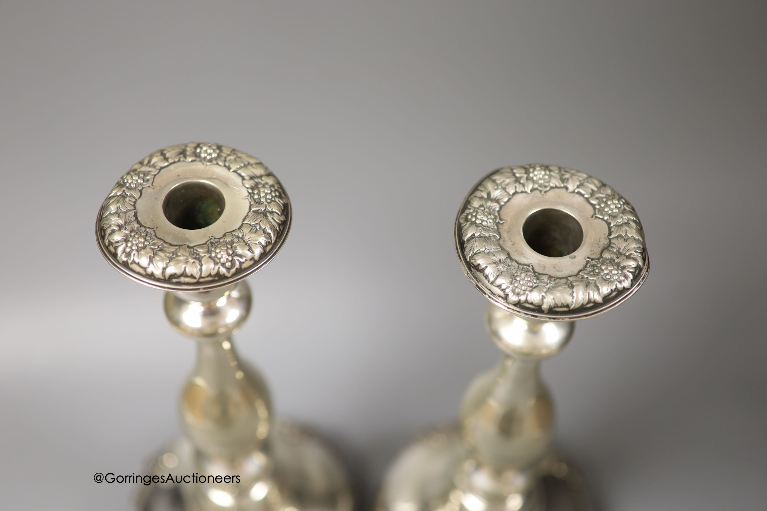 A pair of 19th century Polish? white metal candlesticks, 33.1cm, weighted